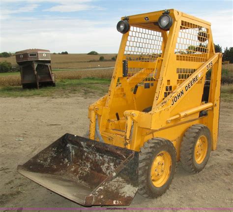 john deere 375 skid steer attachments|john deere skid steer tracks.